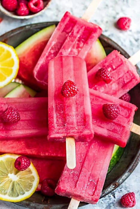 This recipe for 3 Ingredient Watermelon Raspberry Popsicles are the perfect easy frozen treat for summer. Best of all, only a few ingredients and super simple to customize. A delicious cool treat for kids and adults to cool down with on a hot summer day.