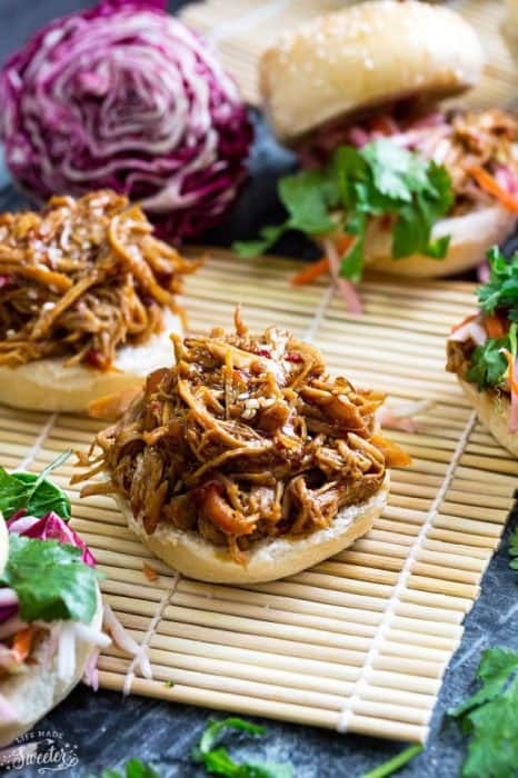 Balsamic Honey Pulled Pork Sliders make the perfect easy dinner or game day party appetizers! Best of all, the soft and tender pork comes together easily in the slow cooker so you can still watch the football game while these cook up!