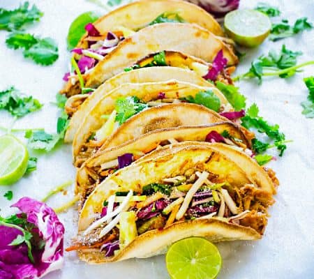 This recipe for Tropical Bahn Mi Tacos make a fun and easy meal for Cinco de Mayo or Taco Tuesday! Filled with a flavorful Asian-styled pulled pork, pickled vegetables, sweet pineapples and a splash of lime juice.