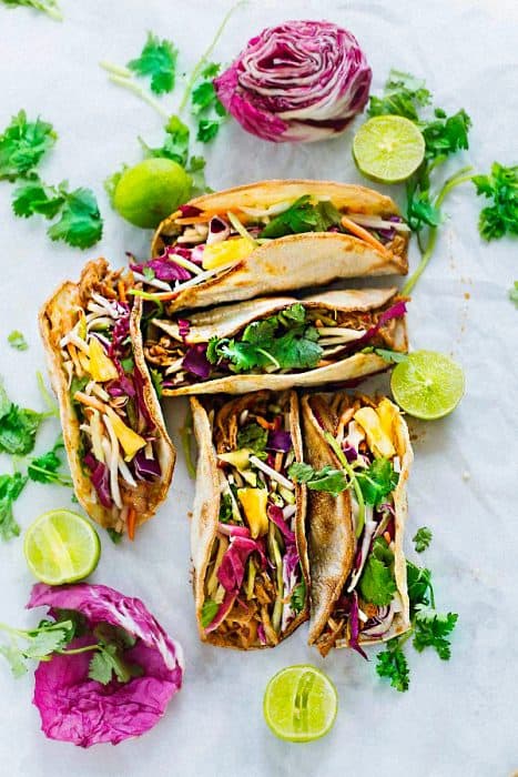 This recipe for Tropical Bahn Mi Tacos make a fun and easy meal for Cinco de Mayo or Taco Tuesday! Filled with a flavorful Asian-styled pulled pork, pickled vegetables, sweet pineapples and a splash of lime juice.