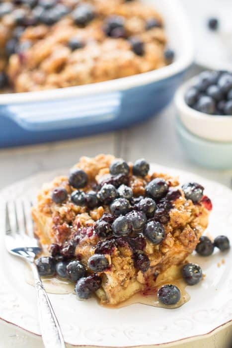 Overnight Blueberry Cream Cheese French Toast Bake - An easy and delicious baked French Toast bursting with blueberries and cream cheese. Perfect for breakfast, brunch or even dinner and best of all, so easy to assemble the night before!