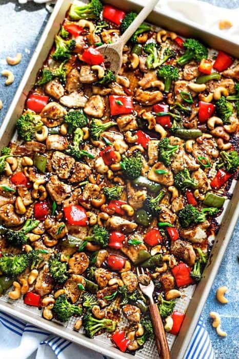 Cashew Chicken Sheet Pan has all the flavors of the popular Chinese restaurant takeout dish made on a sheet pan. Best of all, super easy to make with paleo friendly options. Plus a serving of tender crisp broccoli and red & green bell peppers for a healthier meal. Perfect for busy weeknights! Plus a step-by-step how to video! Weekly Sunday meal prep for the week and leftovers are great for lunch bowls & lunchboxes for work or school.