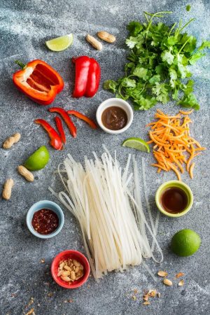 Easy and Authentic Chicken Pad Thai makes the perfect simple weeknight meal and great for Sunday meal prep and leftovers are great for school lunchboxes and work lunch bowls. Best of all, this recipe has gluten free & paleo-friendly options and can cook up in just one pot (pan) with make-ahead tips. Full of the authentic Thai flavors we all love! Way better than any restaurant takeout!