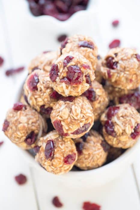 No Bake Cranberry Coconut Energy Bites make the perfect healthy gluten free snack on the go and are so easy to make and customize. Best of all, they make a great vegan, gluten free snack option with NO added REFINED sugar. Great for Sunday meal prep for adding to back to school or work lunchboxes.