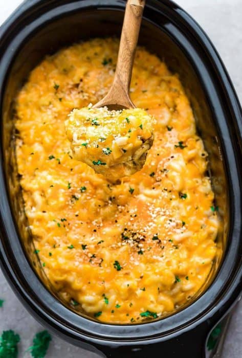 Crock Pot Macaroni and Cheese are the perfect easy and comforting dish for potlucks, parties and game day. Best of all, everything cooks up in the slow cooker - even the pasta so no boiling required! Made with four favorite cheeses for the ultimate creamy mac and cheese!