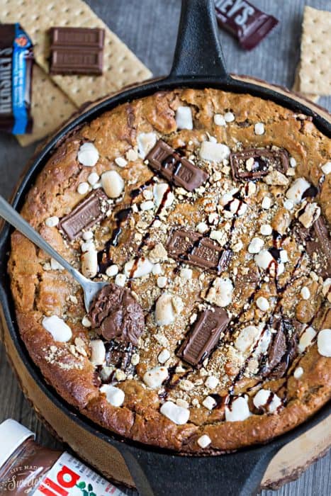 Flourless Nutella Stuffed S'mores Skillet Cookie makes the perfect easy decadent sweet treat for sharing at a party!