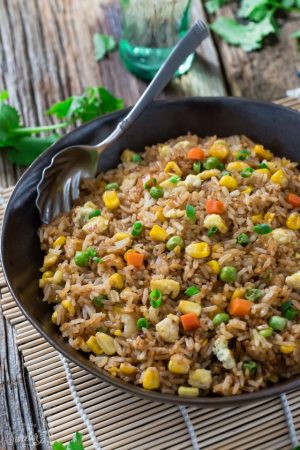 Chinese Fried Rice makes the perfect easy weeknight dish. With the most authentic flavors! My father was the head chef at a top Hong Kong Chinese restaurant and this was his specialty! So delicious and way better than any takeout!