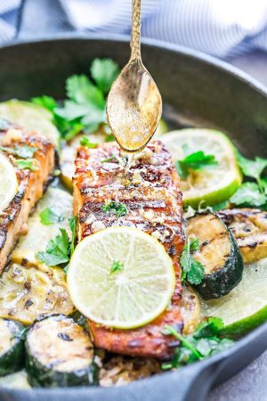 This Honey Lime Salmon is a light and tasty dish that is just perfect for summer and busy weeknights. Best of all, it can be made on the grill or in your oven. It's marinated with a delicious sweet and tangy honey and lime butter sauce and the salmon gets cooked to tender flaky perfection every time! Clean up is a breeze if you want to roast it in foil packs or cook it directly on the grill for those pretty grill marks!