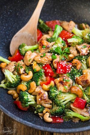 Healthy Cashew Chicken - an easy 20 minute guilt-free gluten free skinny version (plus paleo friendly options) of the popular classic Chinese takeout dish. Plus a serving of tender crisp broccoli and red bell peppers for a healthier meal. Best of all, this recipe comes together in less than 30 minutes in just one pan and perfect for busy weeknights!