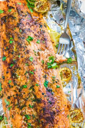 Honey Lemon Salmon in foil is baked to tender, flaky perfection. Best of all, it's fresh, flavorful and super delicious! Comes together in less than 30 minutes and is just perfect for busy weeknights! With sweet and tangy honey, lemon and parsley and the perfect spring or summer meal!