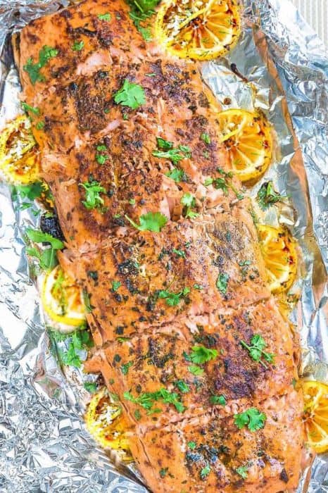 Honey Lemon Salmon in foil is baked to tender, flaky perfection. Best of all, it's fresh, flavorful and super delicious! Comes together in less than 30 minutes and is just perfect for busy weeknights! With sweet and tangy honey, lemon and parsley and the perfect spring or summer meal!