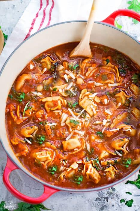 This delicious recipe for Italian Sausage Tortellini Tomato Soup is the perfect comforting soup for busy weeknights! Best of all, it's so easy to make and packed with with the most amazing flavors. Made with cheese tortellini, Italian sausage, arugula and tomatoes. Hearty, filling and easy to customize with your favorite greens or vegetables for a nutritious lunch or dinner.