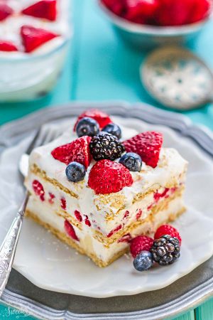 No Bake Mixed Summer Berry Icebox Cake is the perfect easy dessert for potlucks, barbecues, cookouts, picnics, baby showers, or any Fourth of July or Memorial Day party with the red, white and blue theme. Best of all, instead of triple, it's got four berries - strawberries, blackberries, blueberries and raspberries with 10 minutes of prep time containing fresh whipped cream, cream cheese & graham crackers.