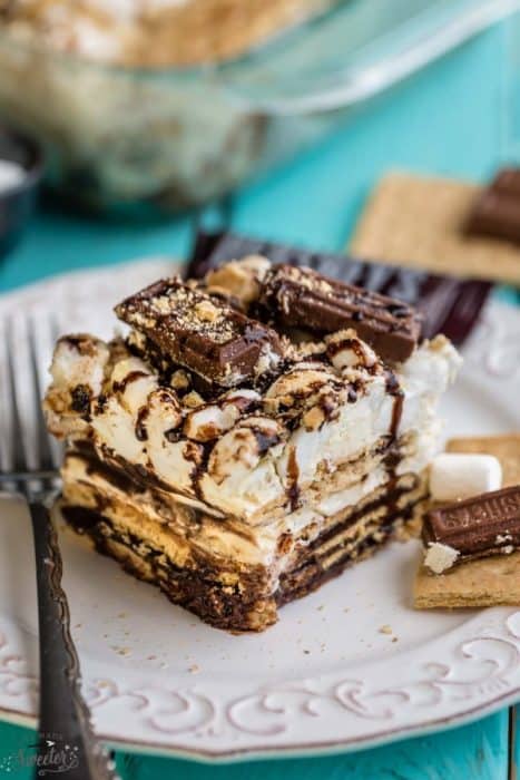 No Bake S'mores Icebox Cake makes the perfect easy cool treat!! Combines all the classic flavors of s'mores in a no-bake treat. Best of all, no campfire needed!