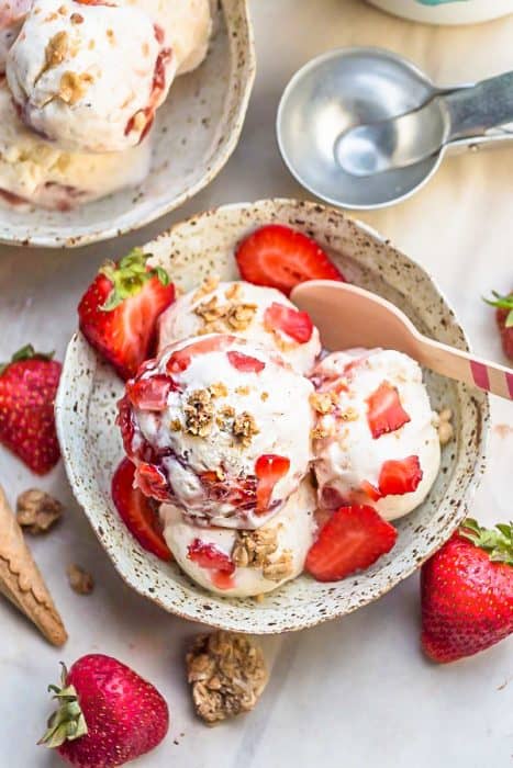 No Churn Strawberry Cheesecake Ice Cream is the perfect frozen sweet treat for summer. Best of all, super simple to make and no ice cream maker needed! Full of delicious fresh strawberries, cream cheese and crunchy granola streusel clusters.