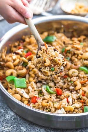 One Pot Cashew Chicken Rice is the perfect easy weeknight meal. Best of all, everything cooks up in just ONE pan {plus bonus Instant Pot pressure cooker instructions} and has all the flavors of your favorite takeout restaurant dish. A great Sunday meal prep recipe for your work or school lunchbox or lunch bowl and way better than takeout!