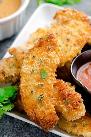 This Oven Baked Fried Chicken Recipe makes perfectly crispy chicken that is juicy and flavorful. The best part of all is how EASY they are so you can skip that takeout stop to KFC and make them at home.