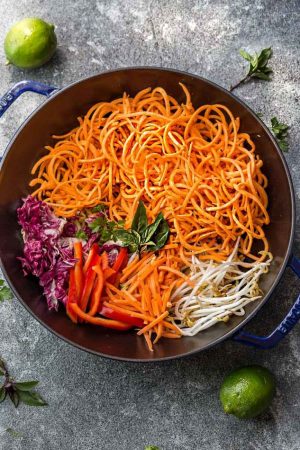 This recipe for Sweet Potato Pad Thai Noodles is the perfect easy 30 minute one pan meal. Best of all, full of all the authentic flavors of the popular restaurant favorite in a grain free version. So delicious and way better and healthier than takeout!