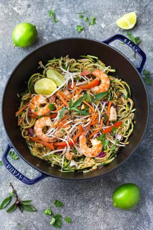 This recipe for Pad Thai Zucchini Noodles (Zoodles) is the perfect easy 30 minute one pan stir-fry meal. Best of all, it's full of all the authentic flavors of the popular restaurant favorite in a grain free version. So delicious and way better and healthier than takeout! Great for Sunday meal prep and packing into school and work lunchboxes and lunch bowls.