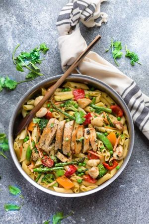 This Pasta Primavera recipe comes together in under 30 minutes so it's perfect for busy weeknights. Best of all, you can serve it with or without chicken and it's chock full of fresh lemon, asparagus, snap peas, carrots and cherry tomatoes. Great for Sunday meal prep and leftovers are delicious for work or school lunchboxes or lunch bowls.