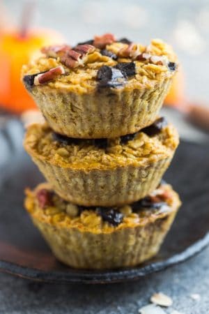 Pumpkin Baked Oatmeal with Chocolate and Pecans - the perfect easy make-ahead breakfast or brunch for fall! Best of all, you can bake them into muffin tins for grab and go oatmeal cups or take them along to work or school. They're full of cozy warm flavors and come together easily in just one bowl using healthy and wholesome ingredients. Gluten free & refined sugar free.