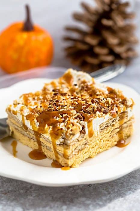 No Bake Pumpkin Icebox Cake makes the perfect make ahead fall dessert. Best of all, takes just minutes to whip up and full of cozy fall flavors! Made with layers of graham crackers and pumpkin cream cheese mousse. A delicious dessert for holiday parties and get togethers and much easier to bring than a pumpkin pie.