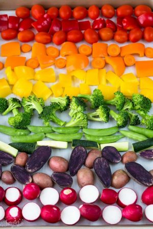 Rainbow Roasted Vegetables makes the perfect easy side dish in a fun presentation for kids and adults. Best of all, this recipe is so easy to customize using any vegetables you like. Great for Sunday meal prep and leftovers are perfect for work or school lunchboxes or lunch bowls. Also great for parties for St. Patrick's Day or potluck and summer BBQ's.