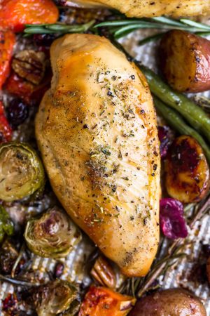 Sheet Pan Turkey Dinner For Two - an easy and healthy one pan Thanksgiving meal for two (or four). Best of all, everything cooks up in under an hour. Includes a juicy turkey, potatoes, green beans, carrots, sweet potatoes and cranberries. 