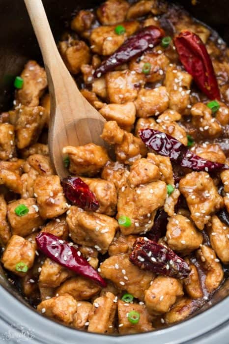 A delicious Skinny Slow Cooker General Tso's Chicken coated in a sweet, savory and spicy sauce that is even better than your local takeout restaurant! Best of all, you can make this in your crock-pot or Instant Pot pressure cooker and it's full of authentic flavors and super easy to make with just 15 minutes of prep time. Skip that takeout menu! This is so much better and healthier! With gluten free and paleo friendly options.