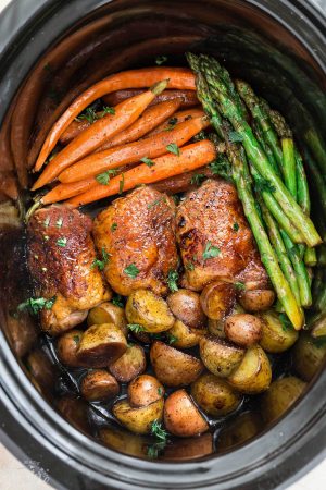 Slow Cooker Harvest Chicken and Autumn Vegetables is an easy set and forget meal that's perfect for busy weeknights and an alternative to Thanksgiving dinner. Best of all, this meal in one is easy to customize and made with tender and juicy chicken, flavorful herbs and hearty fall vegetables. So easy to make with less than 15 minutes of prep time.