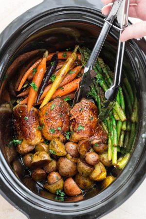 Slow Cooker Harvest Chicken and Autumn Vegetables is an easy set and forget meal that's perfect for busy weeknights and an alternative to Thanksgiving dinner. Best of all, this meal in one is easy to customize and made with tender and juicy chicken, flavorful herbs and hearty fall vegetables. So easy to make with less than 15 minutes of prep time.