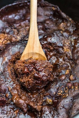 Slow Cooker Hot Fudge Pudding Cake an easy crock-pot dessert perfect for freeing up your oven. With a delicious sauce that forms beneath the cake and best part of all is how easy it is to customize with 4 fun toppings like an ice cream sundae! Plus a step-by-step video!