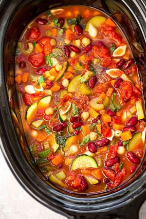 Slow Cooker Homemade Minestrone Soup makes the perfect easy comforting meal. Best of all, it's an easy set and forget recipe and is so much healthier and better than Olive Garden's version! Made entirely in your crock-pot and SO delicious!