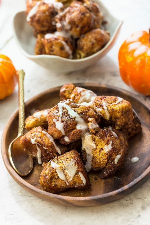 Slow Cooker Pumpkin Monkey Bread makes the perfect easy breakfast or brunch. Best of all, it's so easy to make with refrigerated cinnamon roll dough and it's full of cozy fall spices and a pumpkin cheesecake filling. So delicious for the holidays or any regular day.