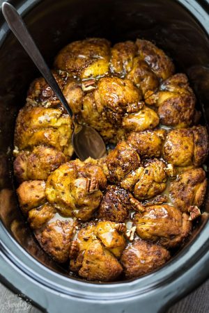 Slow Cooker Pumpkin Monkey Bread makes the perfect easy breakfast or brunch. Best of all, it's so easy to make with refrigerated cinnamon roll dough and it's full of cozy fall spices and a pumpkin cheesecake filling. So delicious for the holidays or any regular day.