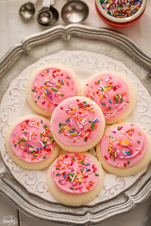 Soft Lofthouse Style Frosted Sugar Cookies are the perfect sweet treat with a tall glass of milk