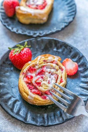 Easy Strawberry Cinnamon Rolls make the perfect indulgent treat for breakfast, brunch or even dessert. Best of all, these effortless rolls take no time at all in your oven or slow cooker using Pillsbury crescent roll dough, fresh strawberries and a cinnamon sugar filling. No yeast or rising required!