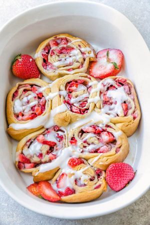 Easy Strawberry Cinnamon Rolls make the perfect indulgent treat for breakfast, brunch or even dessert. Best of all, these effortless rolls take no time at all in your oven or slow cooker using Pillsbury crescent roll dough, fresh strawberries and a cinnamon sugar filling. No yeast or rising required!