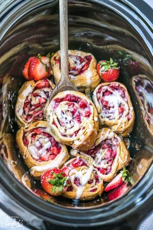 Easy Strawberry Cinnamon Rolls make the perfect indulgent treat for breakfast, brunch or even dessert. Best of all, these effortless rolls take no time at all in your oven or slow cooker using Pillsbury crescent roll dough, fresh strawberries and a cinnamon sugar filling. No yeast or rising required!