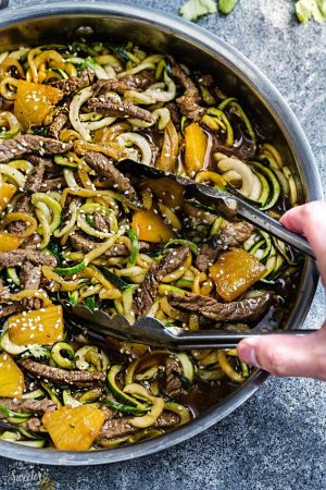 One Pan Teriyaki Beef Stir-Fry {Zucchini Noodles} is the perfect easy gluten free (or paleo) weeknight meal! Best of all, it takes only 30 minutes to make in just one pot and is so much healthier and better than takeout! Great for Sunday meal prep and leftovers make delicious lunch bowls for work or school lunchboxes! Plus Video!