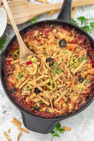 Skillet Tex Mex Casserole makes the perfect easy weeknight meal. You can use easily use chicken or turkey to use up any leftovers from Thanksgiving and the holidays. Best of all it's full of flavorful spices, veggies, quinoa, brown rice and cooks up in just one skillet!